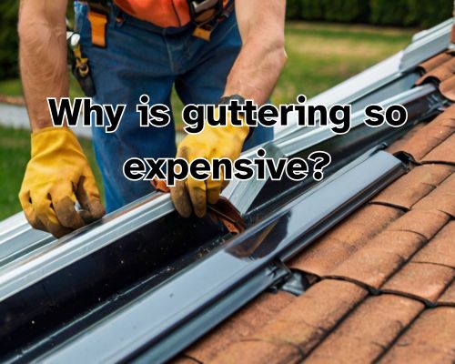 A roofer works meticulously, securing the gutter in place on a steep roof